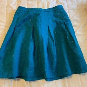 Kirna Zabete teal skirt.